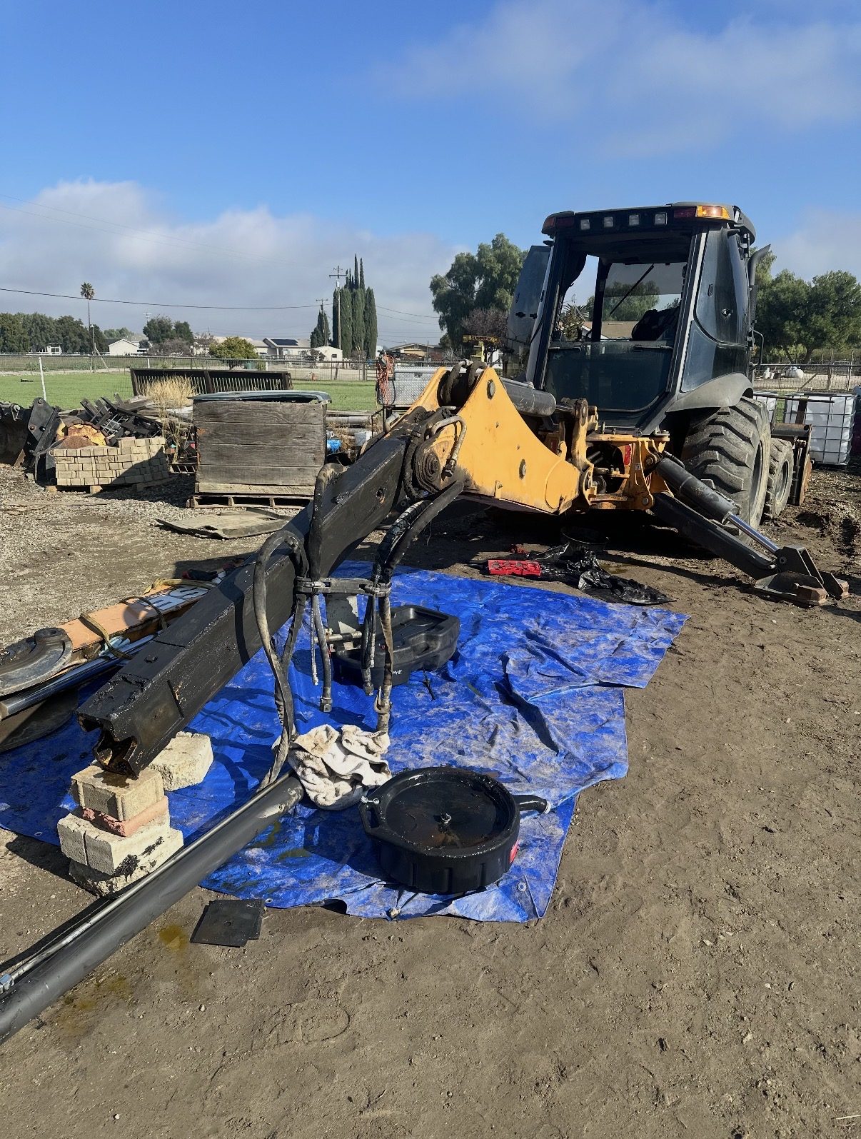 Hydraulic cylinder reseal and boom extension repair on heavy equipment
